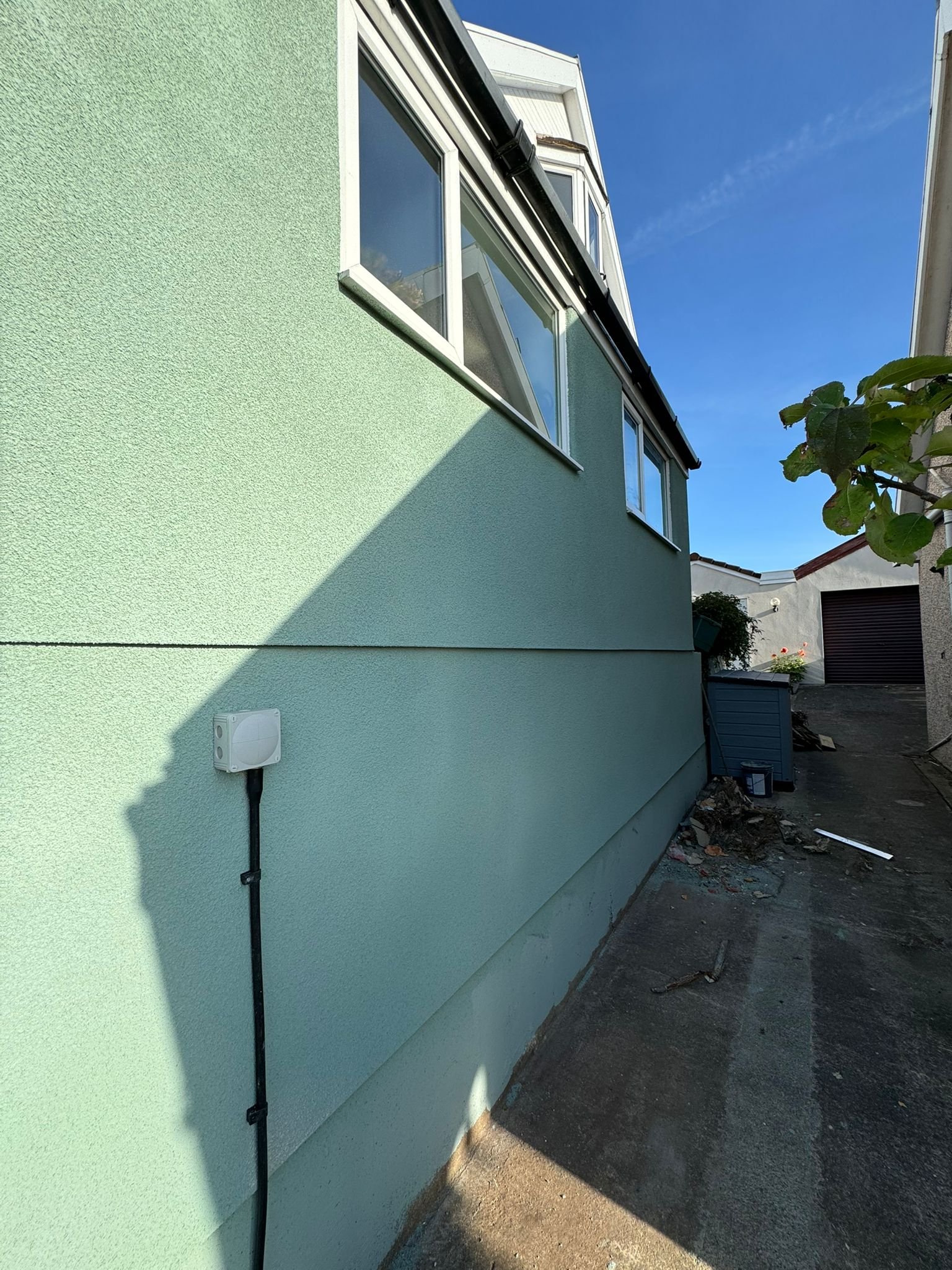 Coloured exterior render finish on Bristol property wall